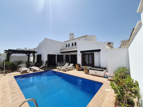 pool view to rear of house and dining area